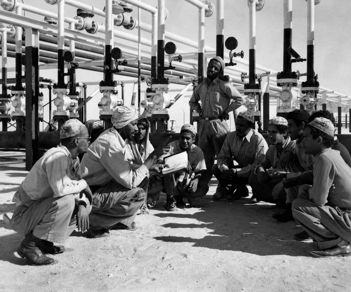 Saudi arabia, workers listen to the instructions of a Indian technical , 1952. Credit: Alamy