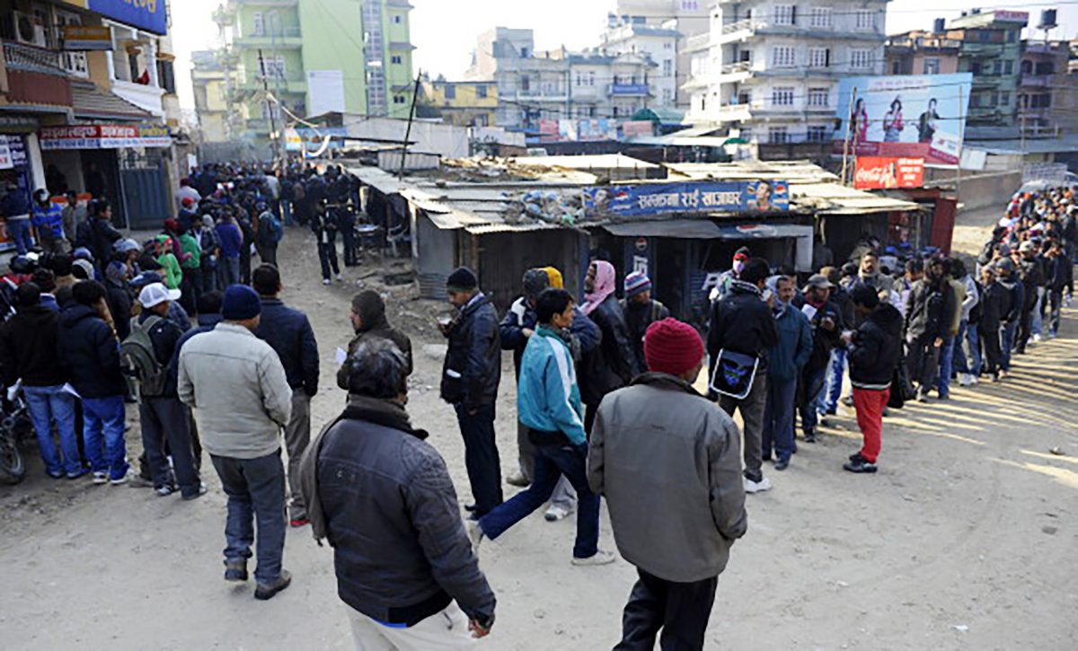 Nepalese migrant workers queue to receive official documents in order to leave Nepal from the Labour department in Kathmandu on January 27, 2014. Nearly 200 Nepali migrant workers died in Qatar in 2013, many of them from heart failure, officials said, figures that highlight the grim plight of labourers in the Gulf nation.